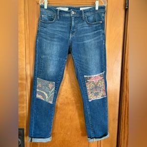 Pilcro Anthropologie Slim Boyfriend Jeans with patterned fabric knee patches.